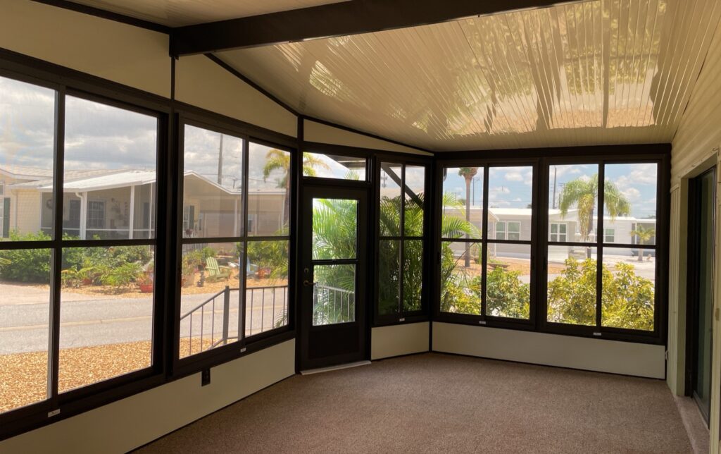 Bronze frame and tint acrylic enclosure with ivory kick plate