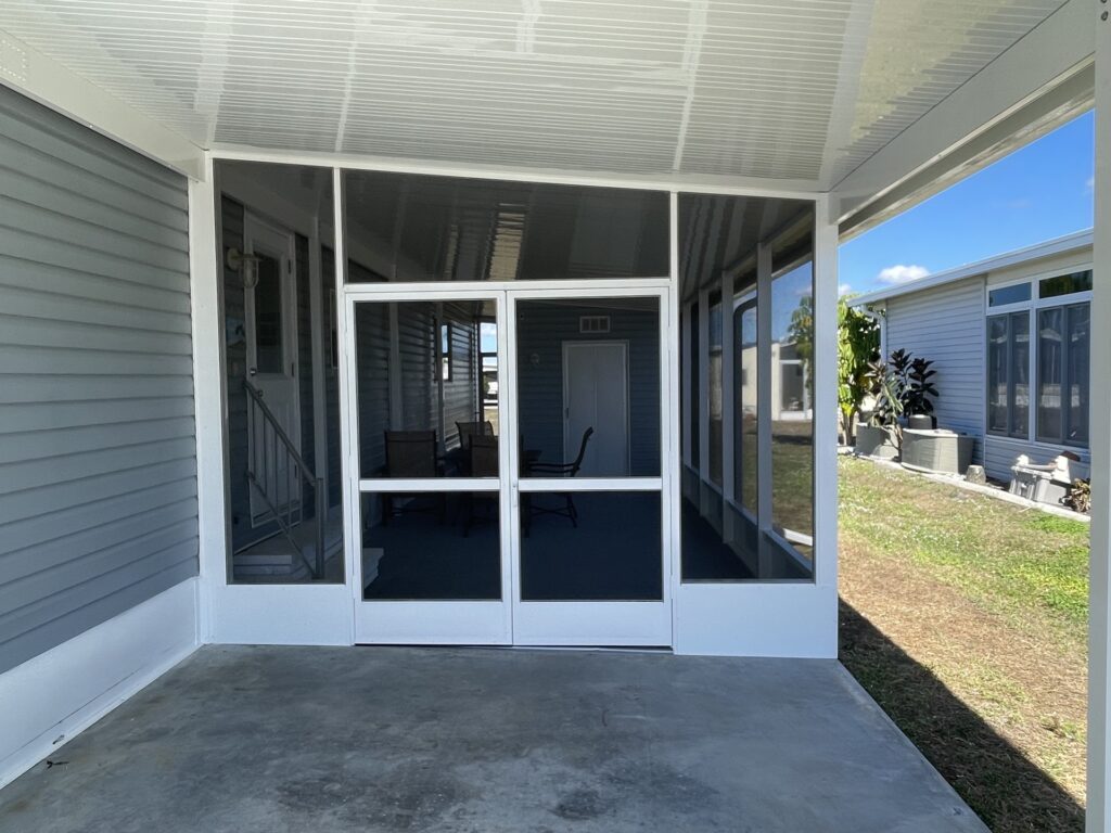 Screen enclosure double entry door