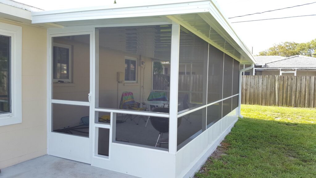 Screen enclosure with kick plate, chair rail and doggie door